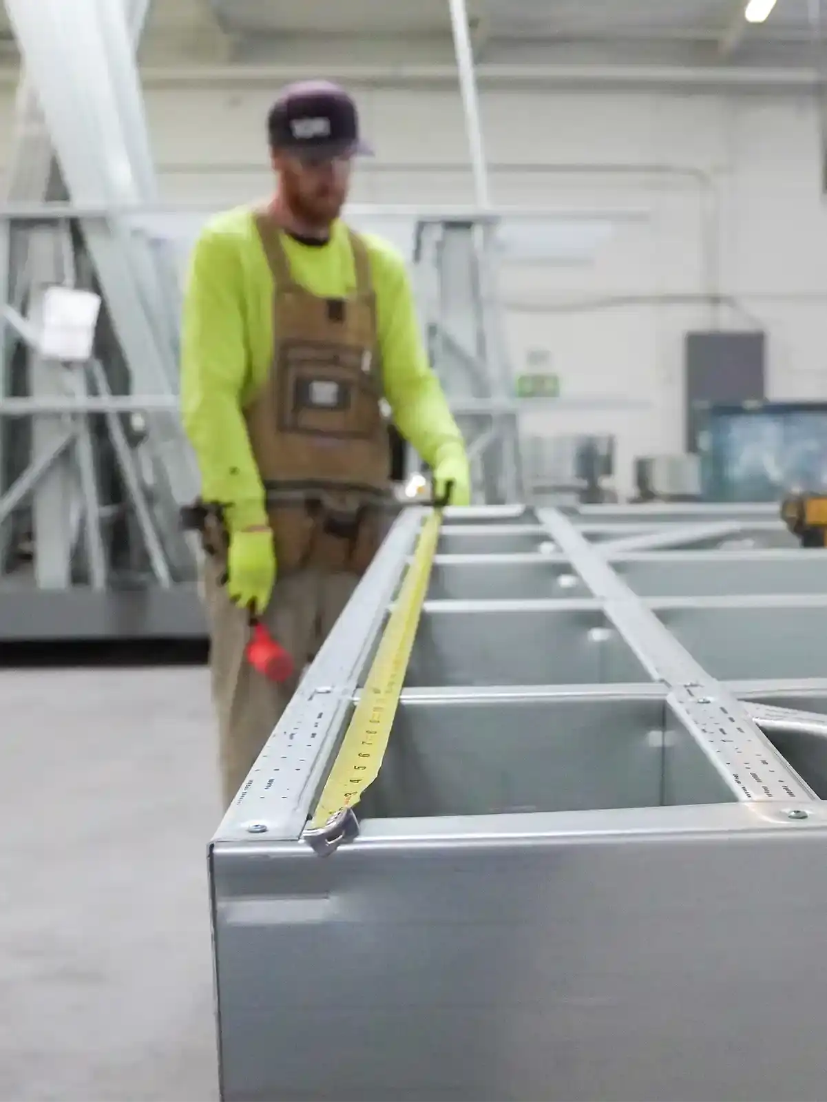Cold-formed steel framing installed along a corridor